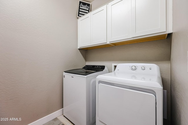 3907 S 75th Dr, Phoenix, AZ 85043 - clothes washing area with washing machine and dryer, baseboards, cabinet space, and a textured wall