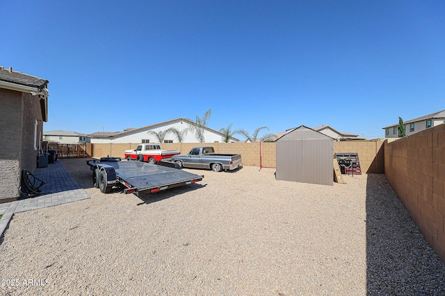 3907 S 75th Dr, Phoenix, AZ 85043 - view of yard with a fenced backyard, an outbuilding, and a shed