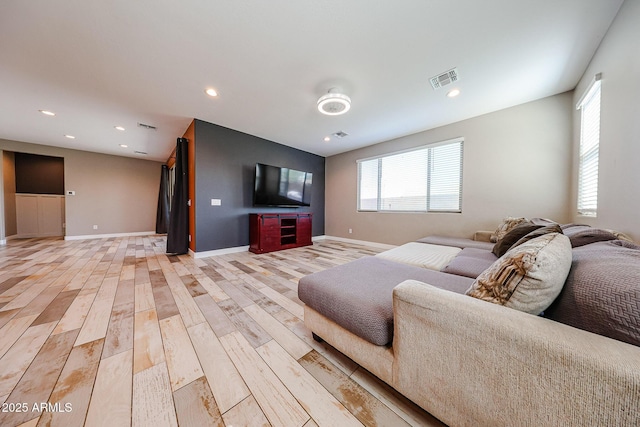 3907 S 75th Dr, Phoenix, AZ 85043 - living room featuring recessed lighting, light wood-style flooring, visible vents, and baseboards
