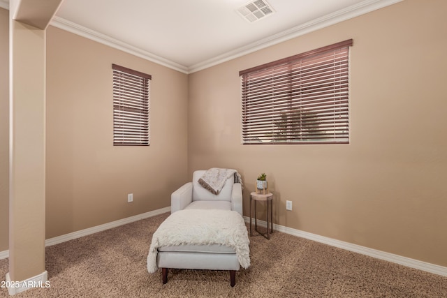 living area with carpet and crown molding