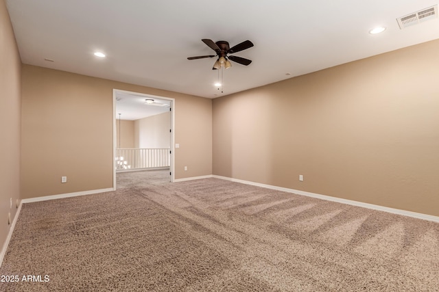 unfurnished room with carpet and ceiling fan