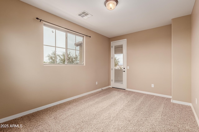 spare room with carpet floors