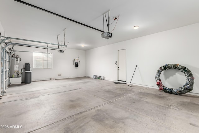 garage featuring gas water heater and a garage door opener