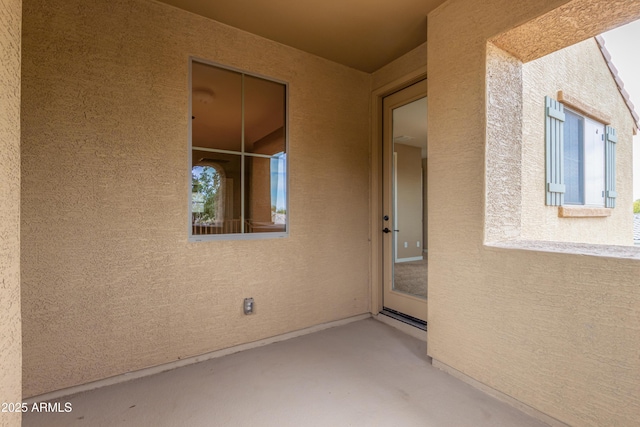 property entrance with a patio area