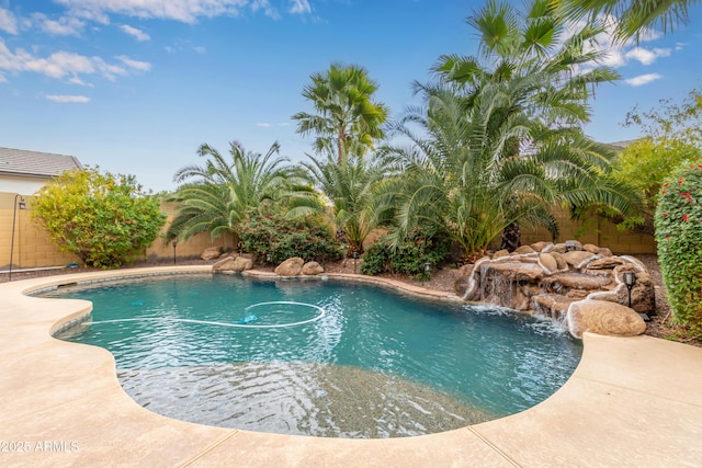 view of swimming pool featuring pool water feature