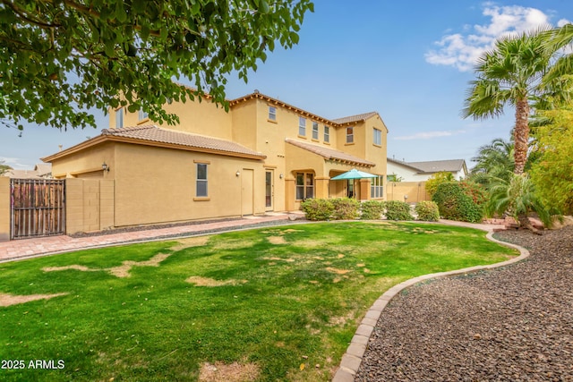 rear view of property featuring a yard