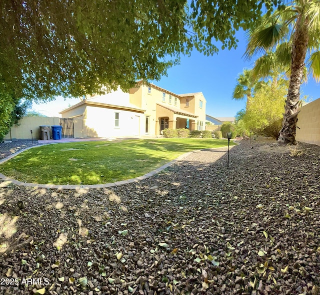 view of home's exterior with a yard