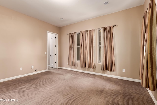 unfurnished room featuring carpet