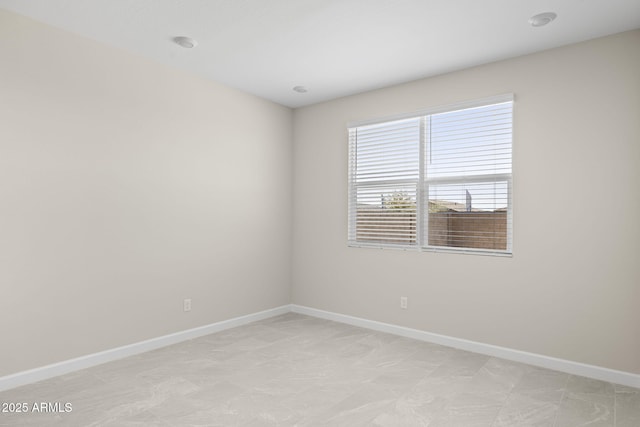 empty room with baseboards