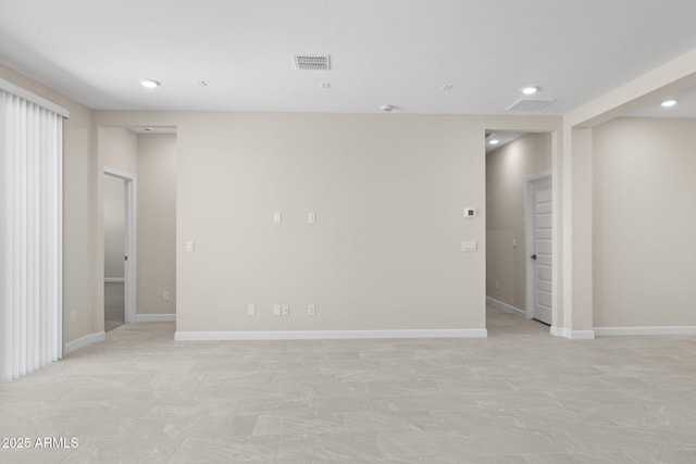 unfurnished room featuring visible vents, baseboards, and recessed lighting