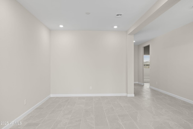 unfurnished room featuring recessed lighting, visible vents, and baseboards