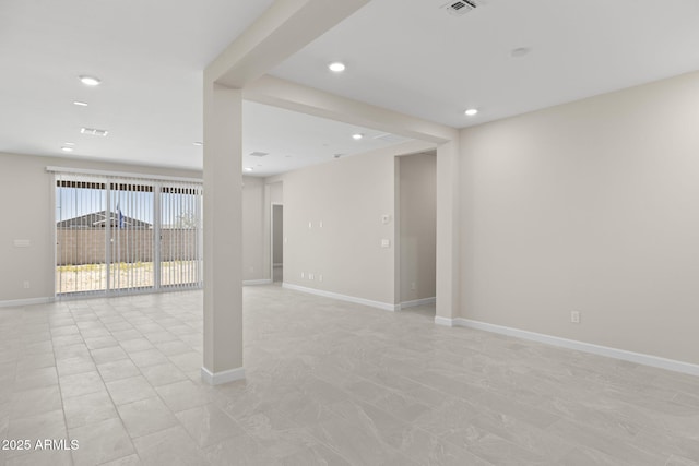 basement with recessed lighting, light tile patterned flooring, and baseboards