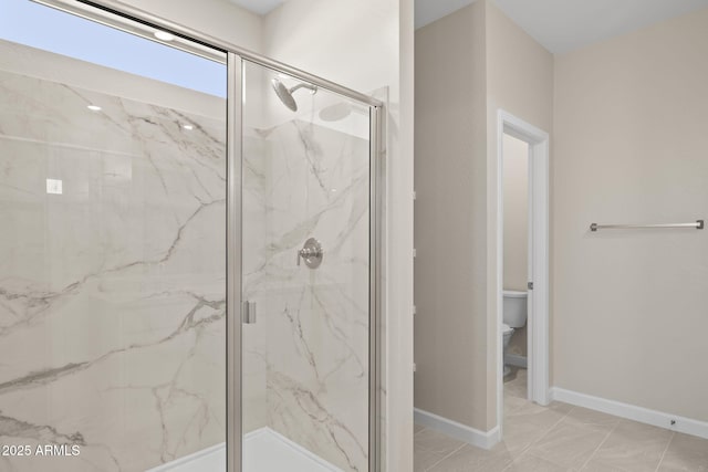 full bathroom with toilet, marble finish floor, a marble finish shower, and baseboards