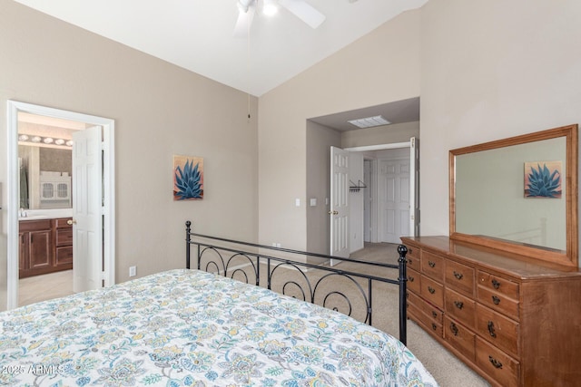 bedroom featuring ensuite bath, visible vents, vaulted ceiling, and light carpet