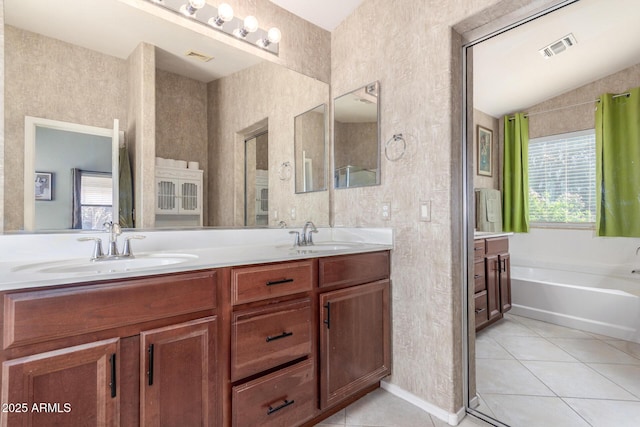 full bathroom featuring tile patterned flooring, a sink, and visible vents