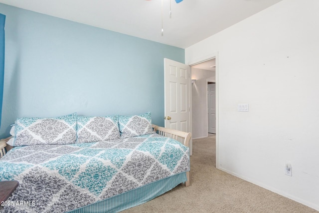 carpeted bedroom with baseboards