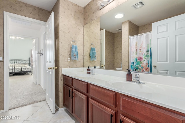 full bathroom with visible vents, wallpapered walls, tile patterned flooring, and a sink