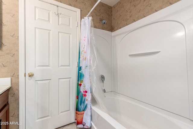 bathroom featuring vanity and shower / bath combo