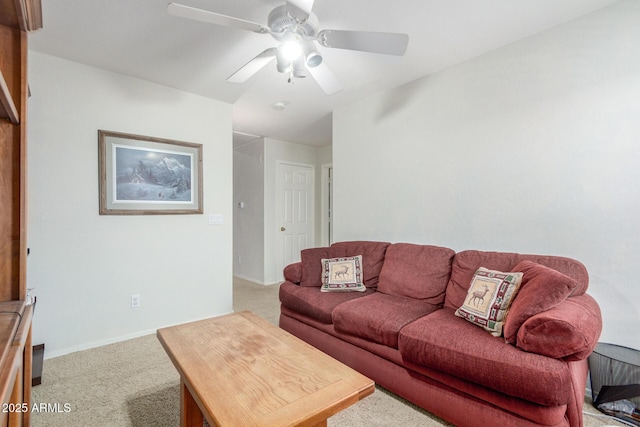 living area with baseboards, carpet flooring, and ceiling fan