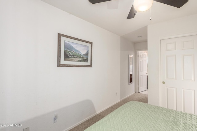 bedroom featuring baseboards, ceiling fan, and light carpet