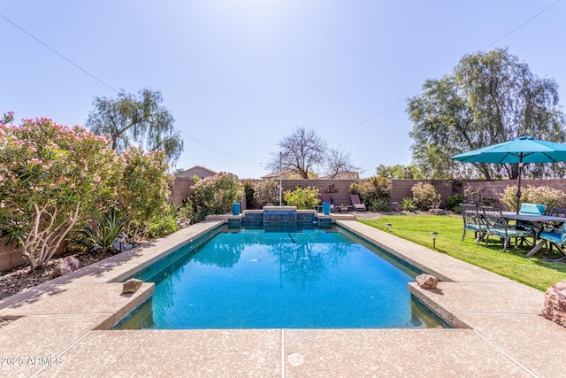 view of pool featuring a fenced backyard, a lawn, and a fenced in pool