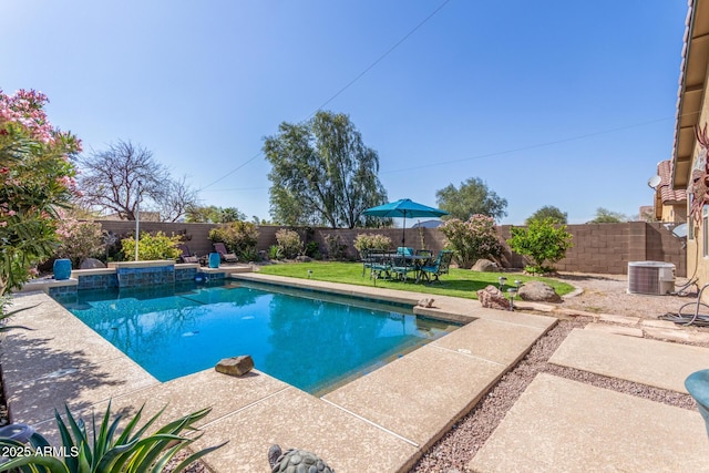 view of swimming pool featuring a fenced backyard, a fenced in pool, a yard, and a patio area