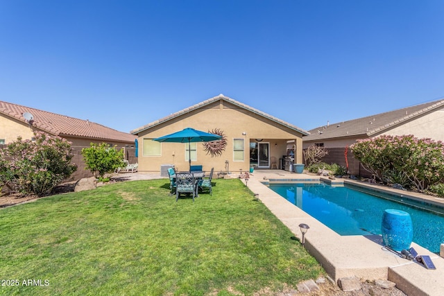view of pool featuring a fenced in pool, fence, a yard, and a patio