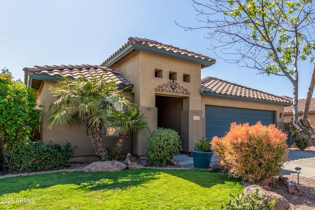 mediterranean / spanish-style house featuring a front lawn, a tile roof, stucco siding, and an attached garage