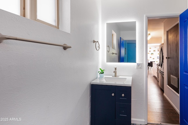 3465 N Jamison Blvd Unit 05, Flagstaff, AZ 86004 - bathroom featuring vanity, wood finished floors, and a textured wall