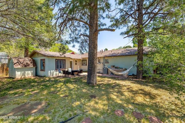 3465 N Jamison Blvd Unit 05, Flagstaff, AZ 86004 - rear view of house featuring a lawn