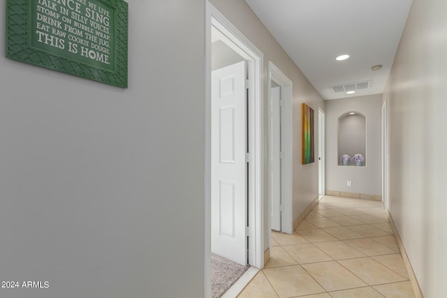 hallway with light tile flooring