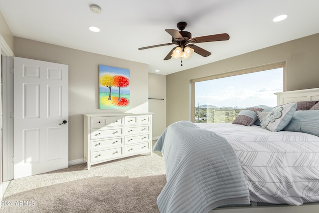 carpeted bedroom with ceiling fan