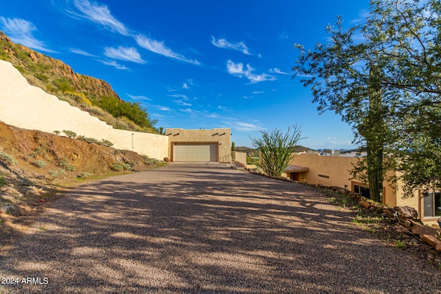 view of front of home featuring a garage and a mountain view