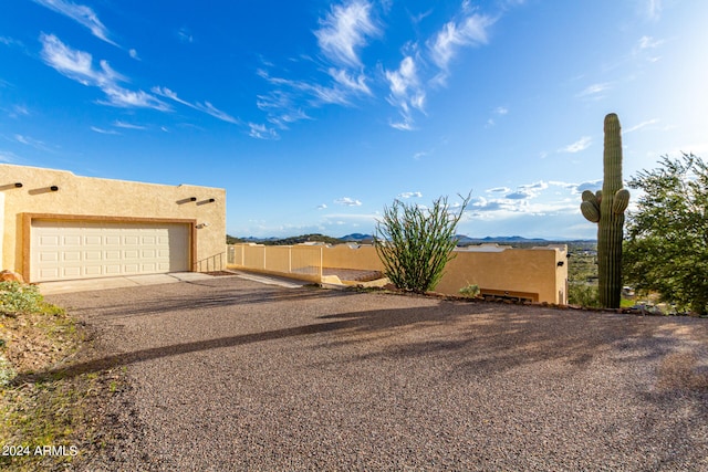 adobe home featuring a garage