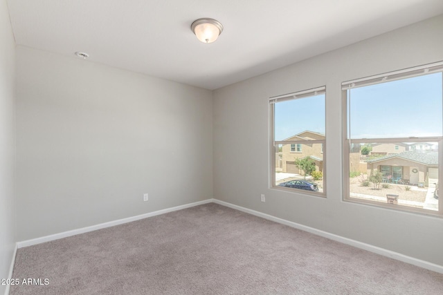 255 W Dewey Ave, Coolidge, AZ 85128 - spare room featuring carpet floors and baseboards