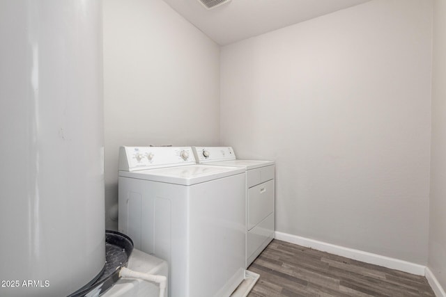 255 W Dewey Ave, Coolidge, AZ 85128 - washroom with washer and clothes dryer, wood finished floors, and baseboards