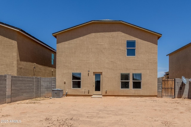 255 W Dewey Ave, Coolidge, AZ 85128 - back of property featuring stucco siding, a fenced backyard, and cooling unit