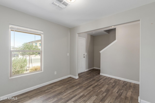 255 W Dewey Ave, Coolidge, AZ 85128 - empty room with dark wood finished floors and baseboards