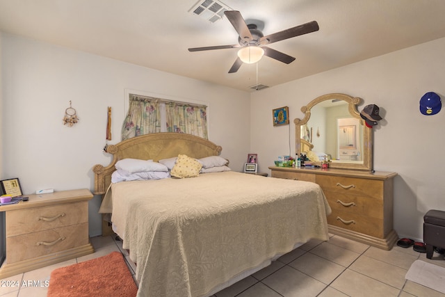 tiled bedroom with ceiling fan