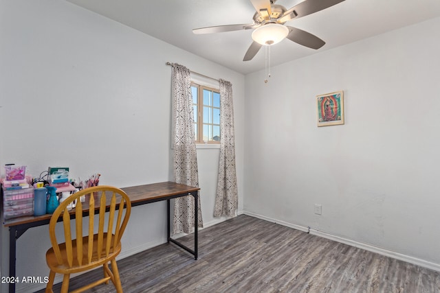 home office with ceiling fan, built in desk, and dark hardwood / wood-style floors