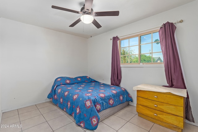 bedroom featuring light tile patterned flooring and ceiling fan