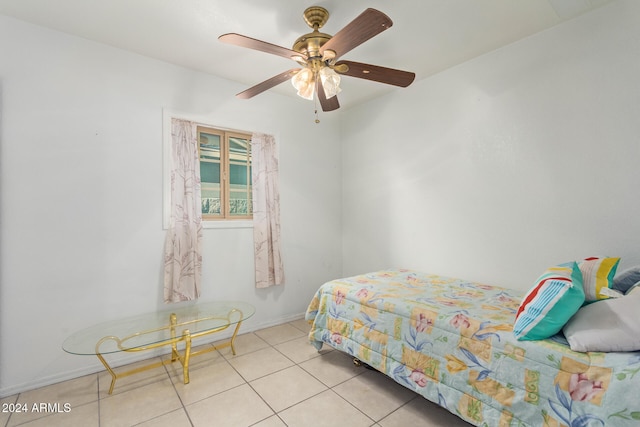 bedroom with ceiling fan and light tile patterned flooring