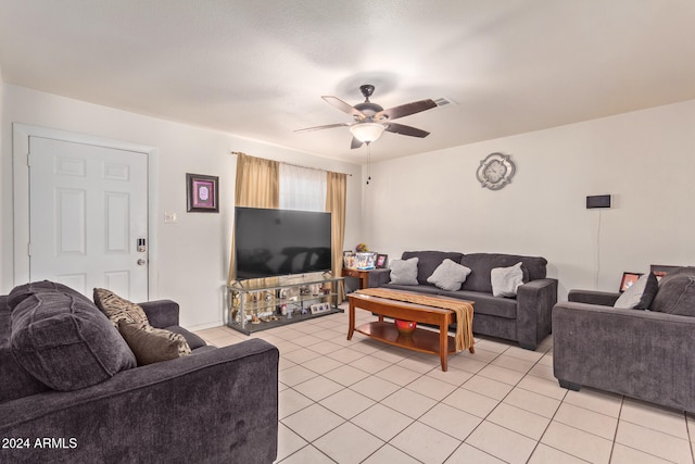 tiled living room with ceiling fan