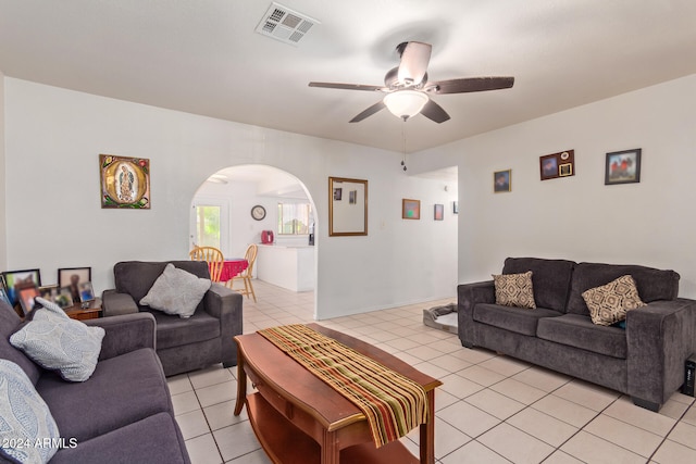 tiled living room featuring ceiling fan