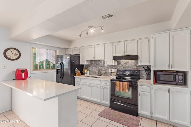 kitchen with light tile patterned flooring, sink, black appliances, kitchen peninsula, and white cabinets