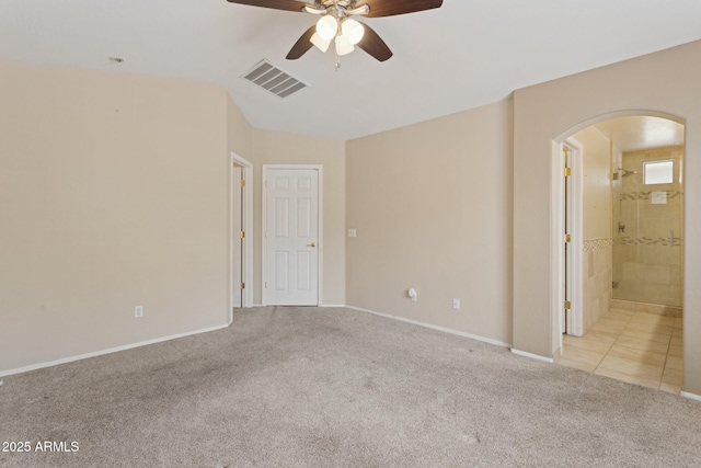 4718 E Woburn Ln, Cave Creek, AZ 85331 - carpeted spare room with arched walkways, ceiling fan, and baseboards