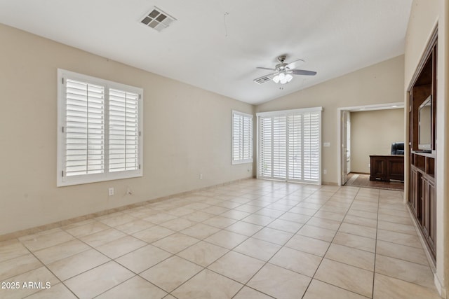 4718 E Woburn Ln, Cave Creek, AZ 85331 - empty room featuring ceiling fan, vaulted ceiling, healthy amount of natural light, and light tile patterned flooring