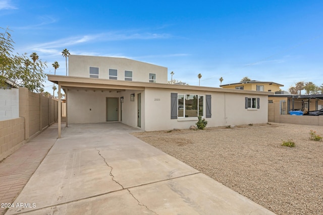 view of front of property with a carport