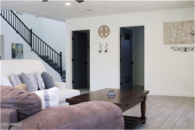 living room with light hardwood / wood-style flooring