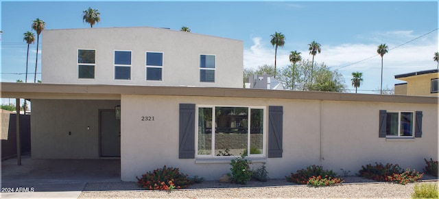 view of front of house with a carport